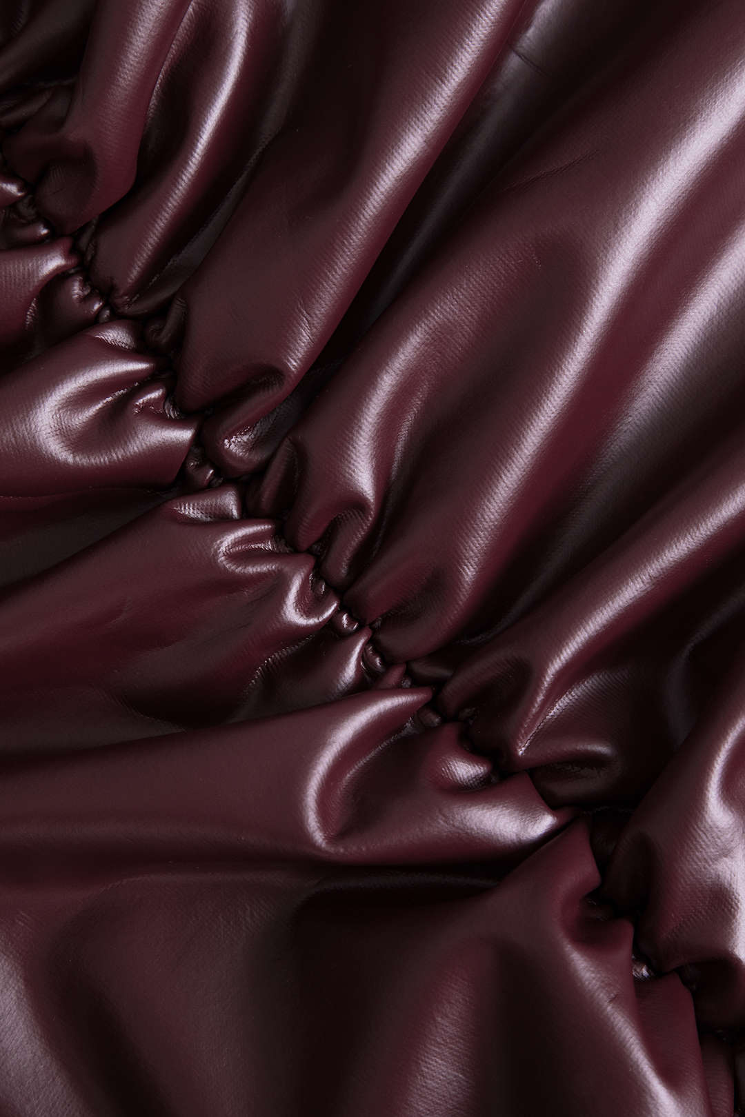 Jocasta | Figure-hugging faux leather mini skirt with side ruching and asymmetrical hem 2