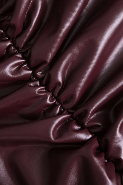 Jocasta | Figure-hugging faux leather mini skirt with side ruching and asymmetrical hem 2